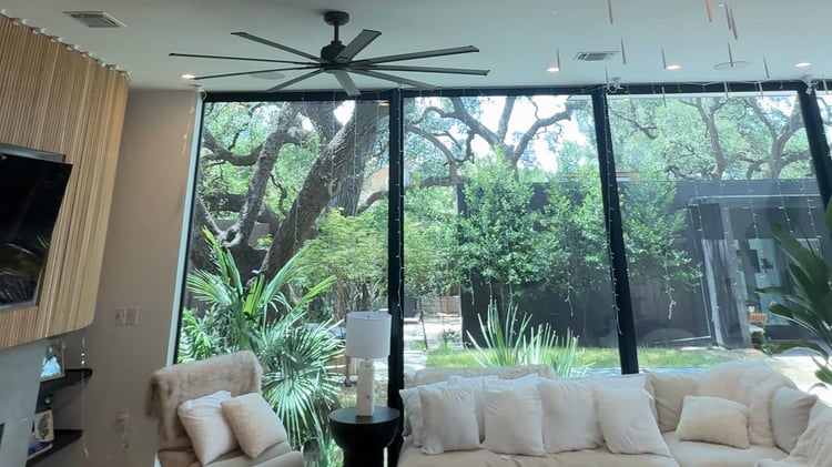 Austin living room before smart lighting transformation with flat overhead recessed lighting